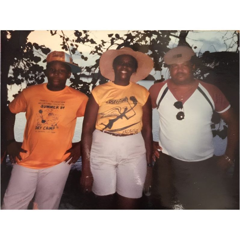 Photograph of Dee with his parents-Alecia and Winston- at Hawksnest Beach in St. John, VI in 1984.